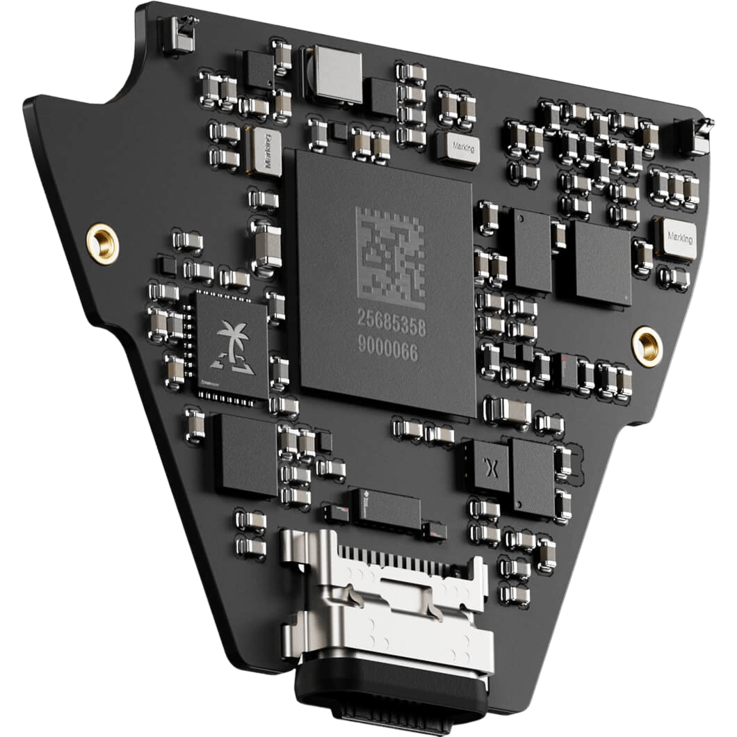 alt="A close-up, angled view of a small, black, custom-shaped circuit board with a large central microchip, a TROPIC01 chip with a palm tree logo, and a USB-C port at the bottom."